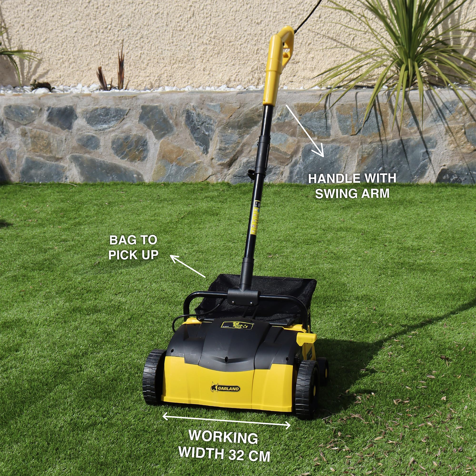 Roll & Comb artificial turf sweeper side view emphasizes ergonomic handle for comfortable sessions