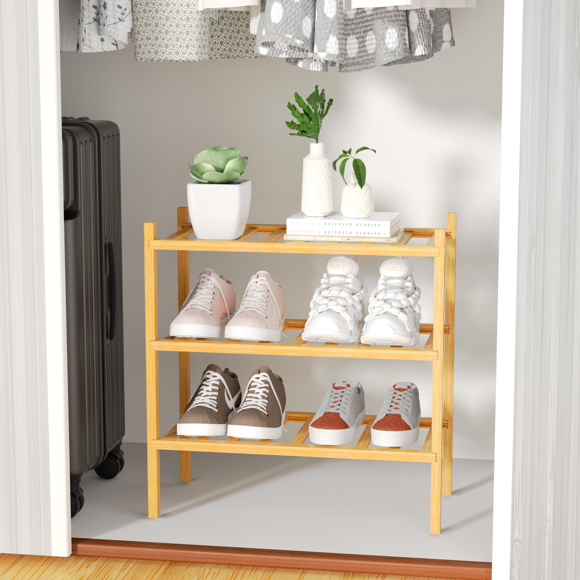 ROMGUAR CRAFT 3-tier bamboo shoe rack in closet, durable bamboo construction.