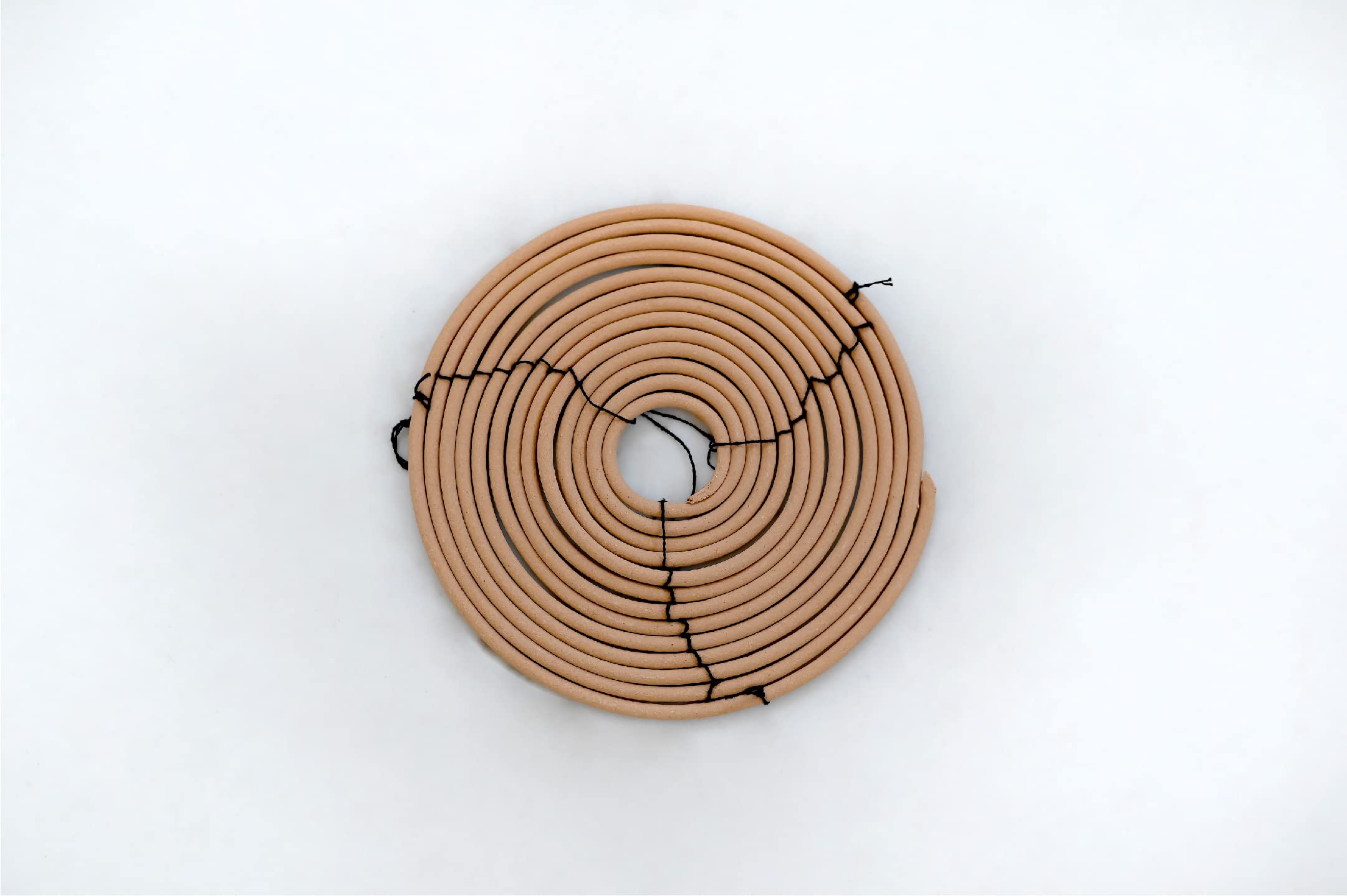 Rool citronella coil 6-inch diameter adds decorative scent touch.