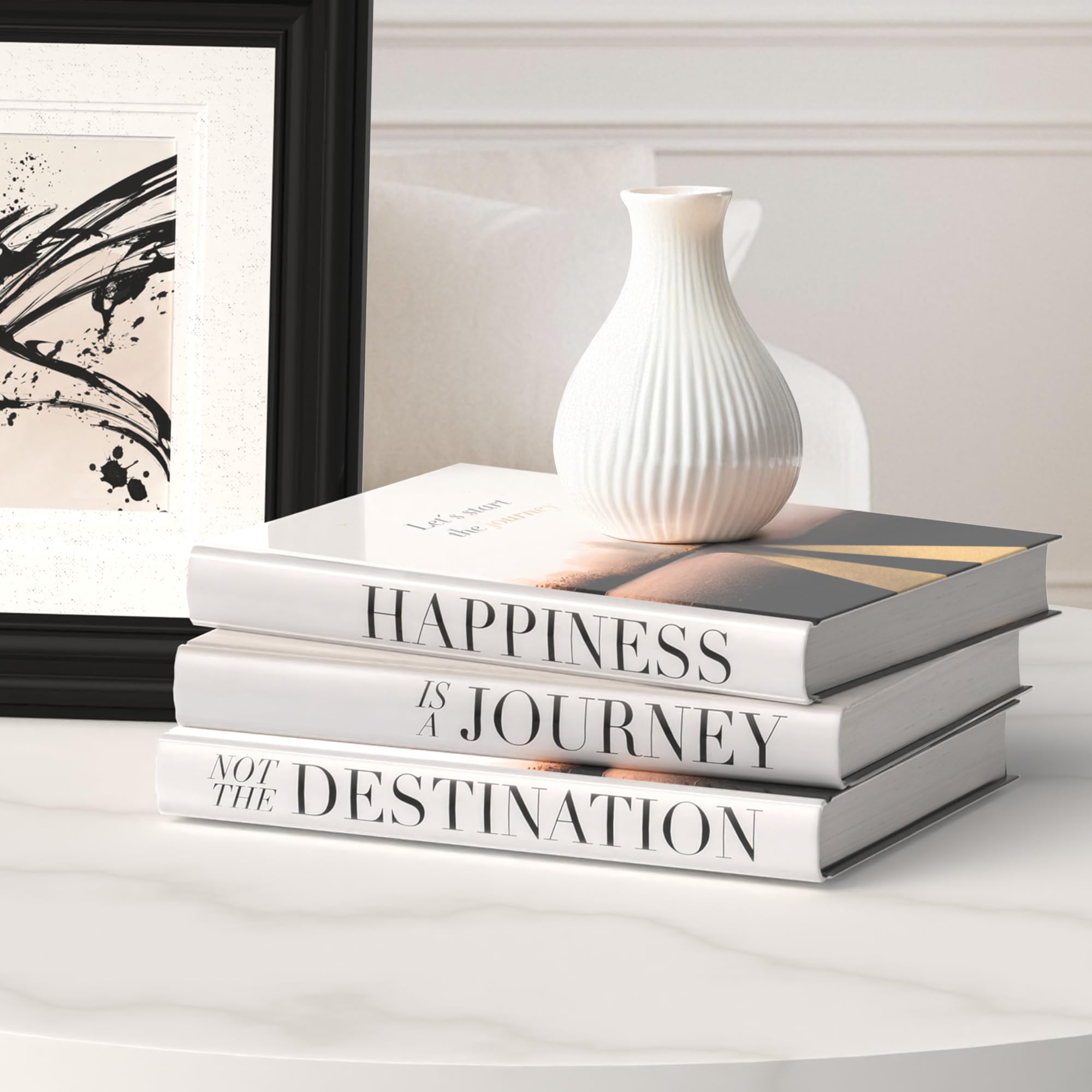 Roomicle decorative books stacked on a coffee table for chic ambience.