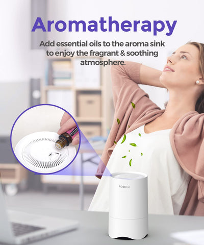 Rosekm compact purifier on a bedside table in a small room