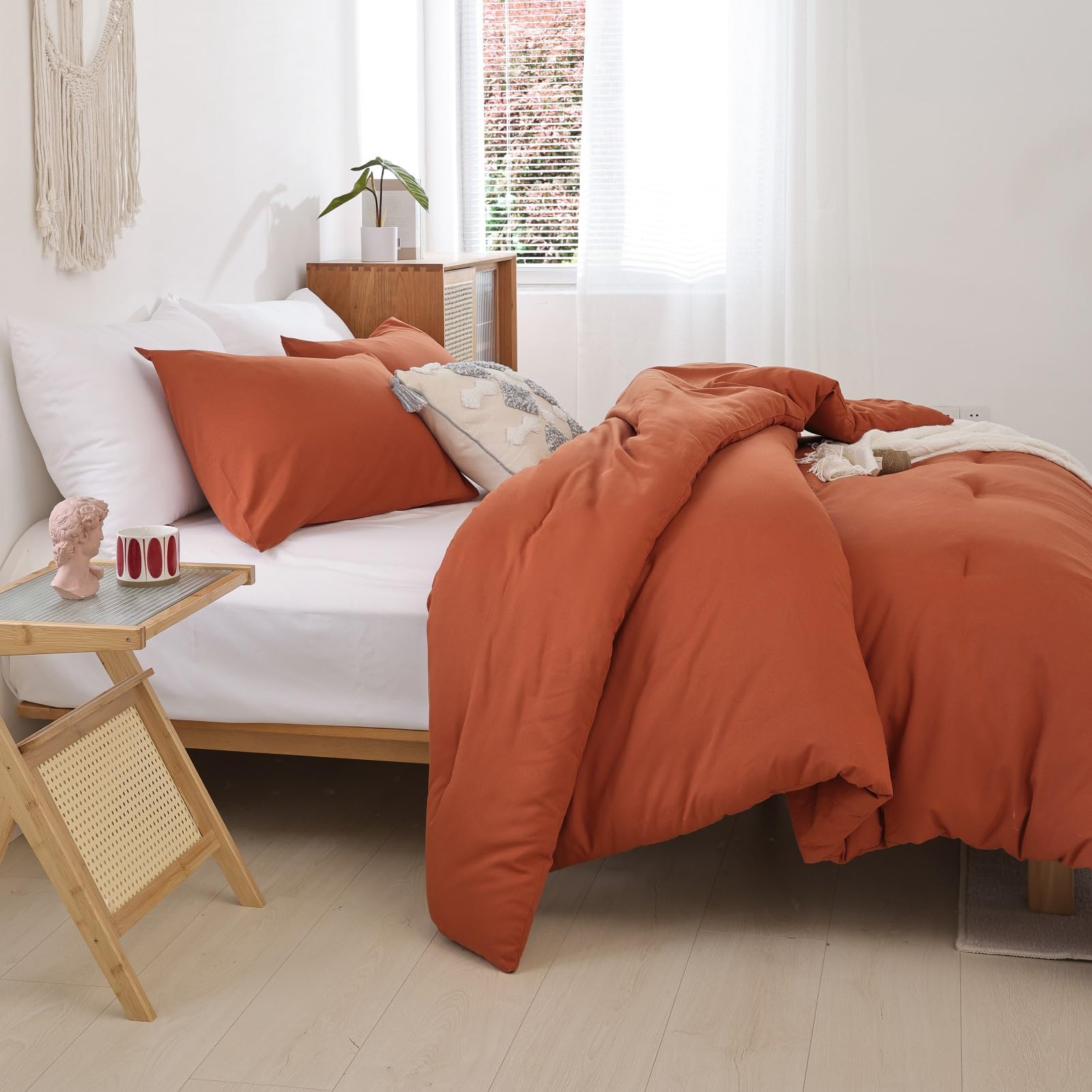 ROSGONIA king-size pillowcases in burnt orange complement the comforter.