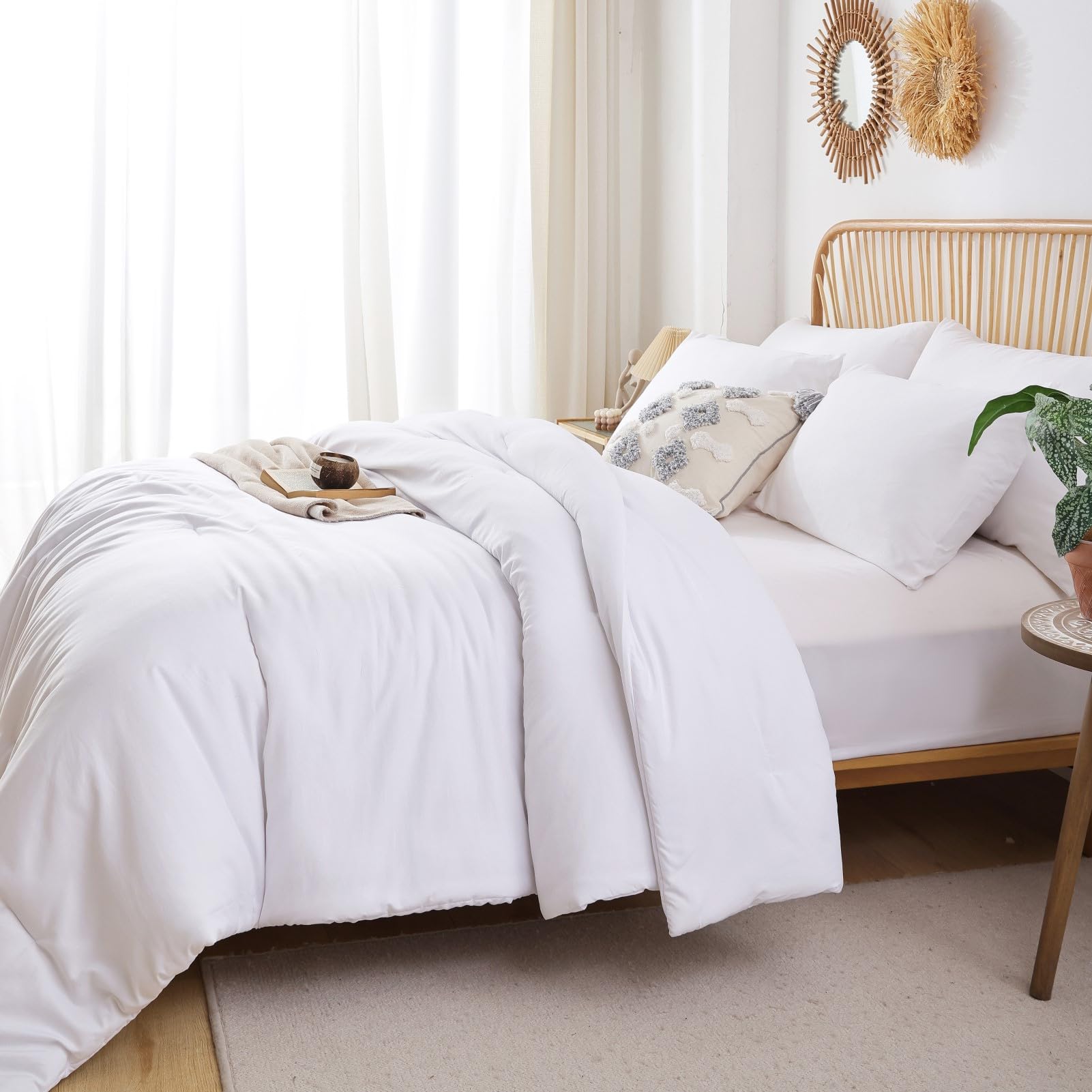 ROSGONIA white queen comforter draped on bed for an elegant boho vibe.
