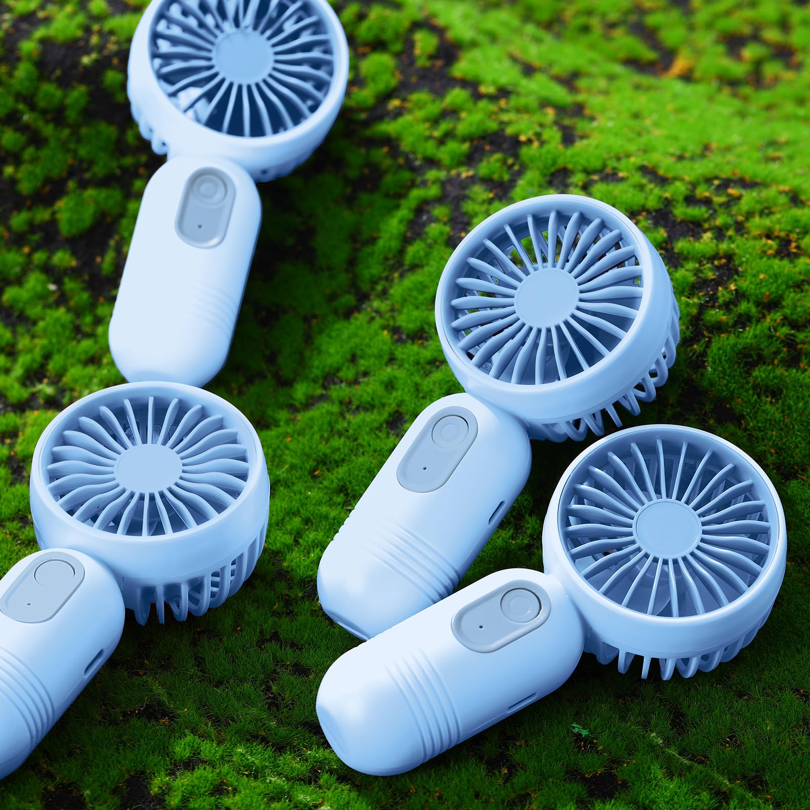 Rossesay mini portable fan Blue in-use, convenient USB recharge on demand.
