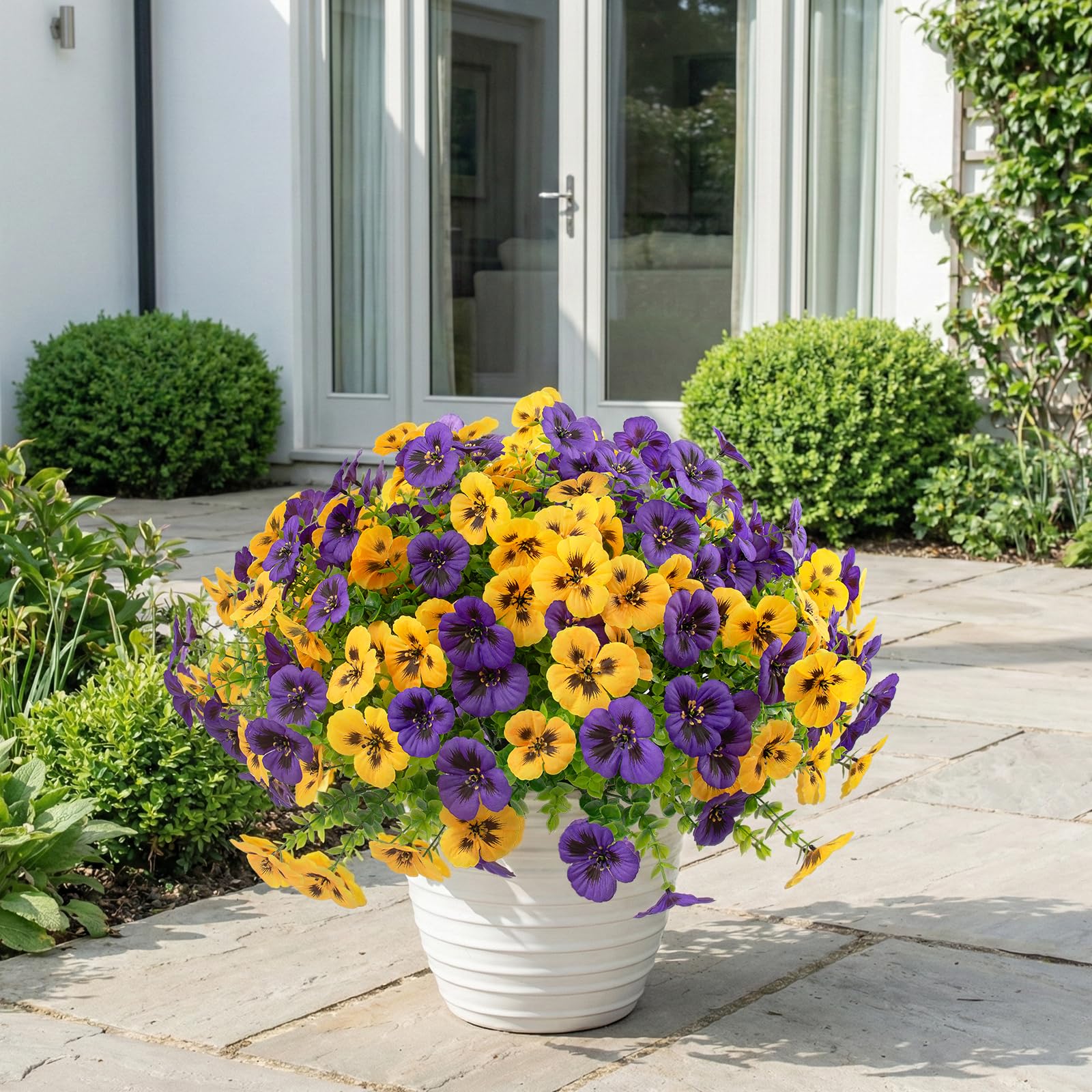 Rowfad outdoor pansies in purple, white, and yellow add color