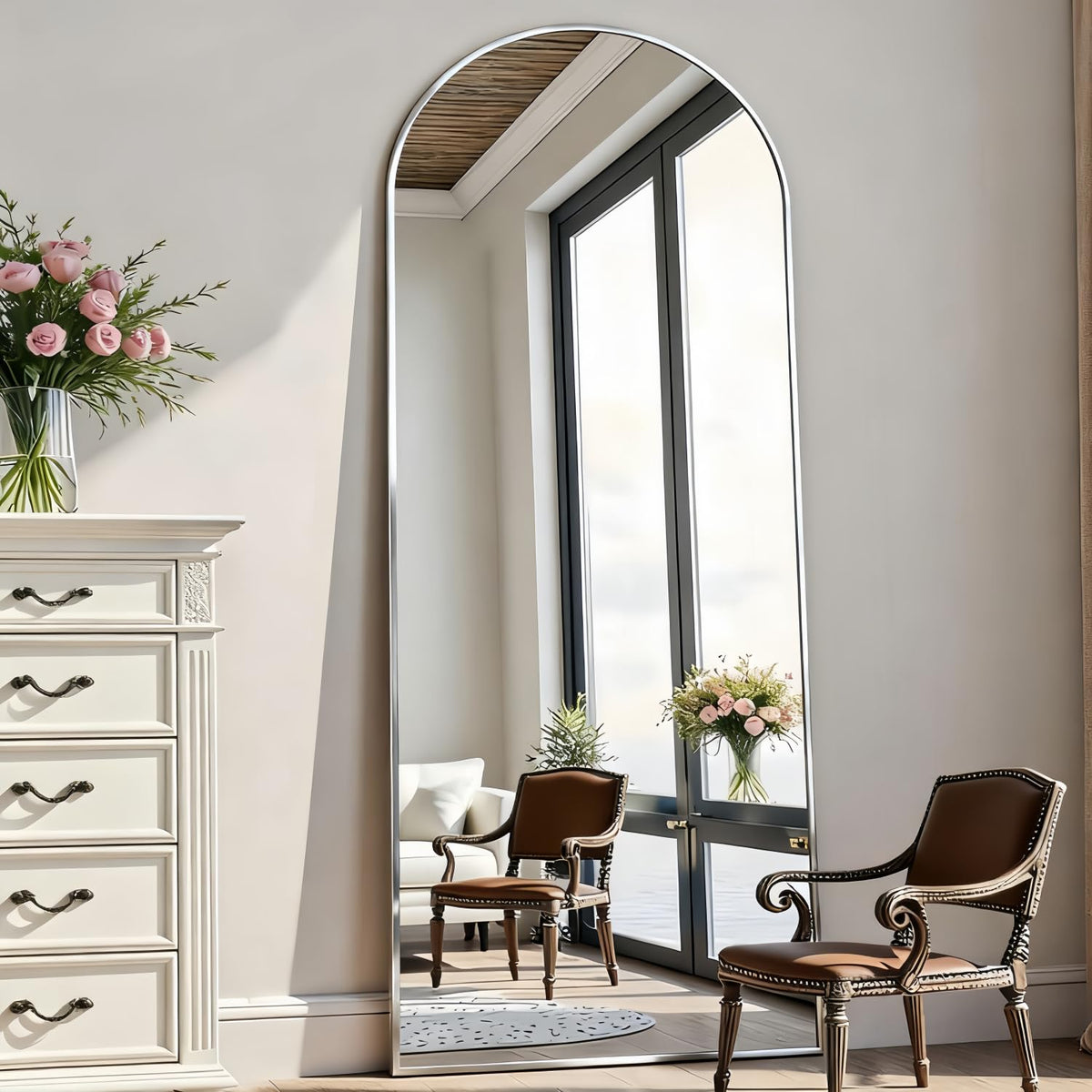 Rowjut arch floor mirror shows full body in silver, ideal for outfit checks.