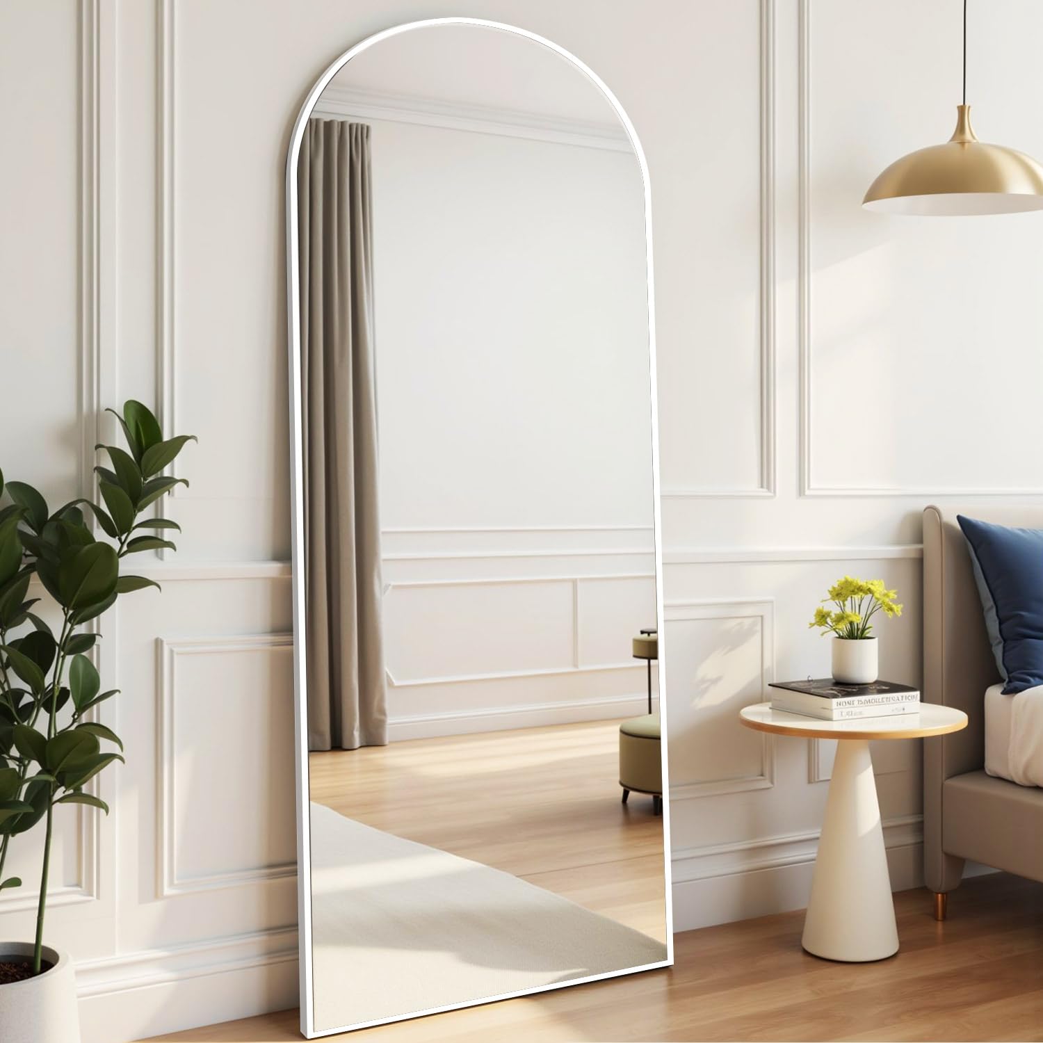 Rowjut full-length mirror in living room reflects and brightens space