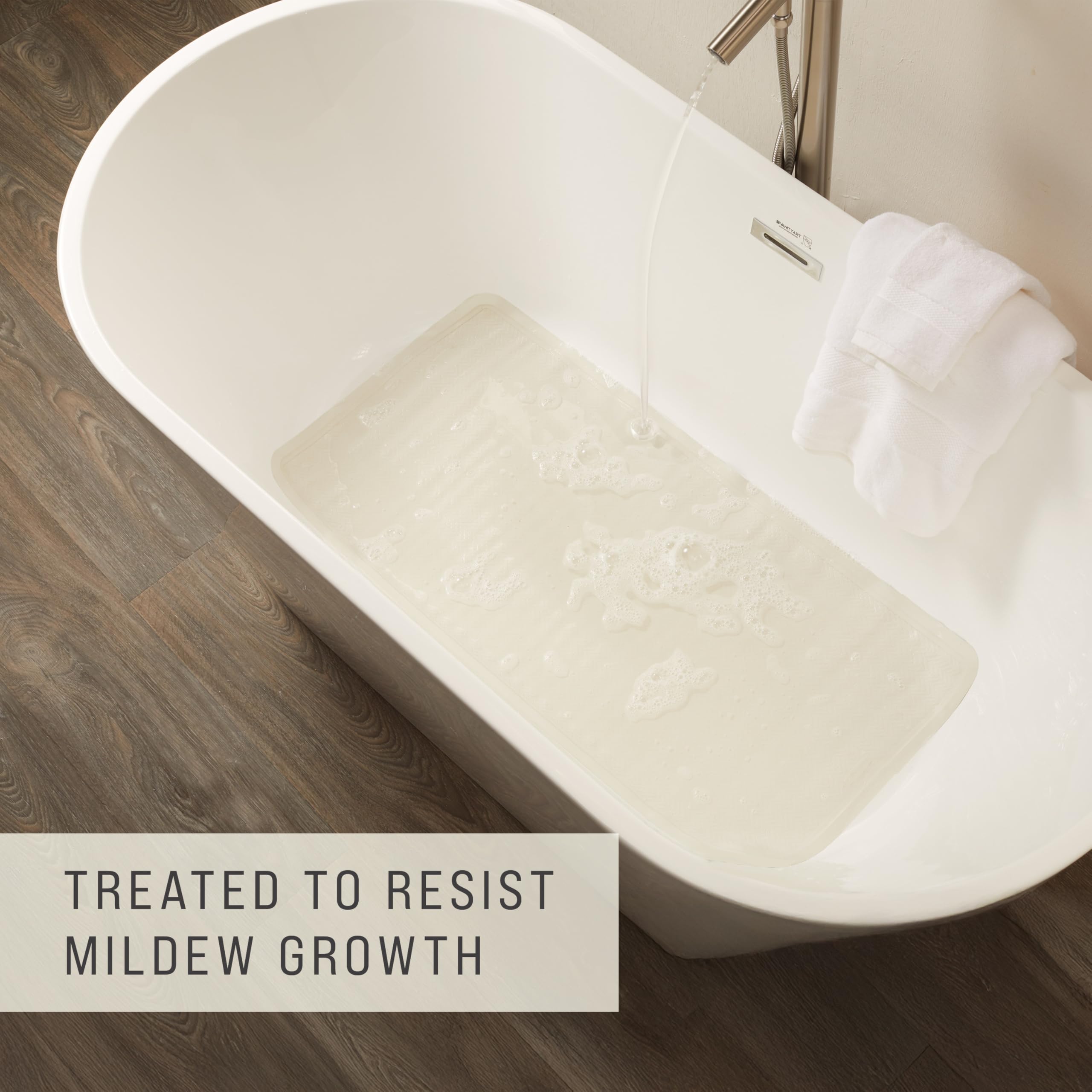 Rubbermaid white bath mat blending with décor while providing slip resistance.