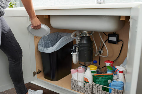 Blue recycling bin for eco-friendly sorting in kitchens.
