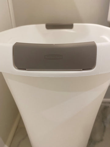 Rubbermaid open-top trash can white compact design in small space