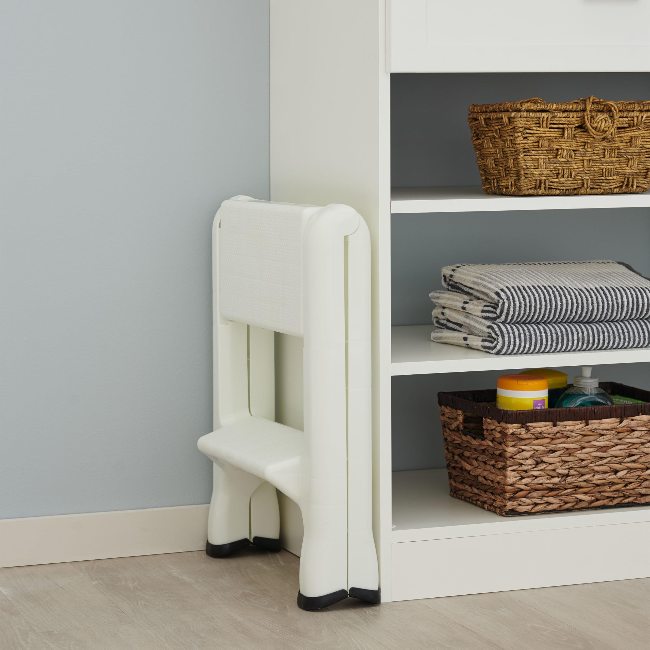 Rubbermaid step stool in kitchen use for reaching cabinets.