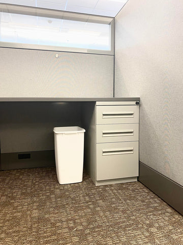 Rubbermaid white under-sink trash bin angled view, great for compact kitchen spaces.
