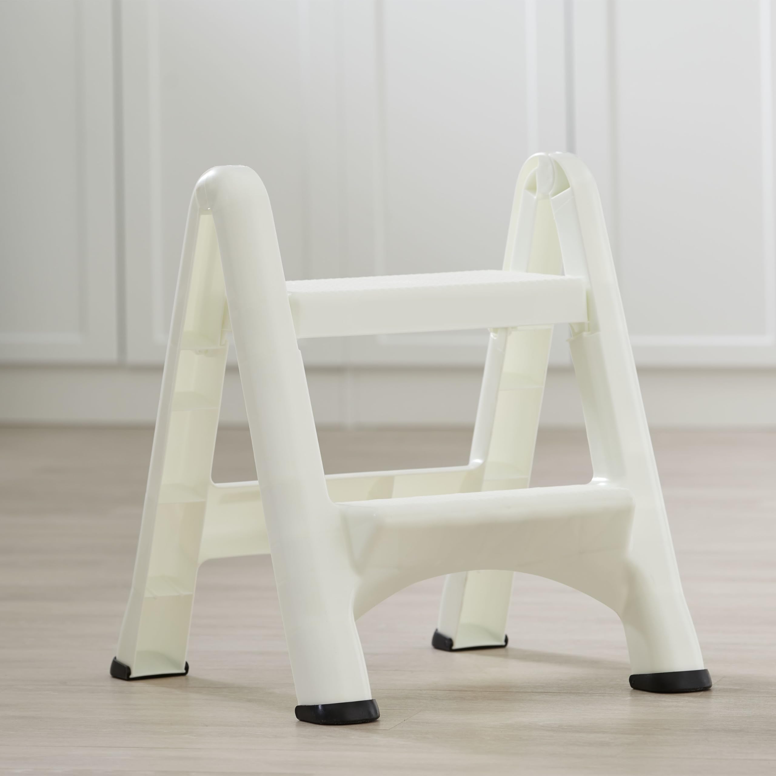 Rubbermaid two-step stool supporting up to 300 pounds for versatile tasks.