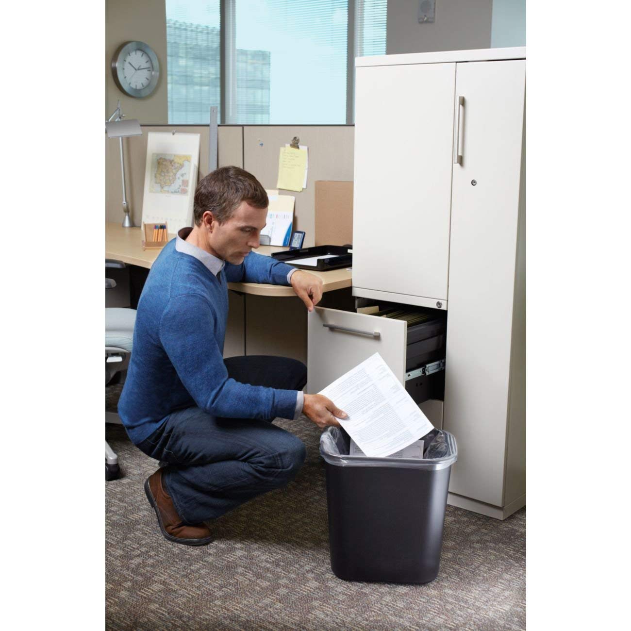 Rubbermaid 7-gallon black wastebasket suitable for bathrooms and bedrooms.