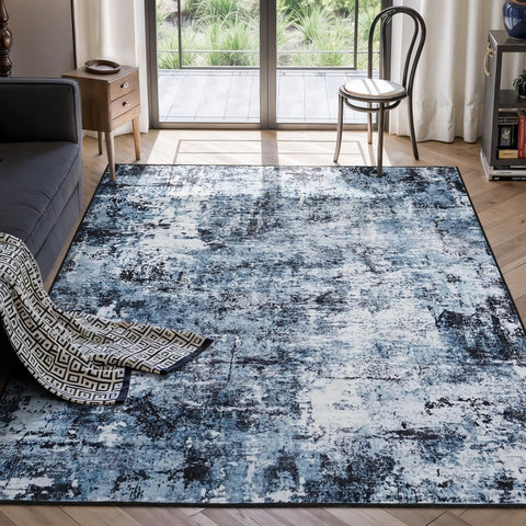 Rugflix 5x7 abstract navy-black rug in a living room for refined style and stain concealment.