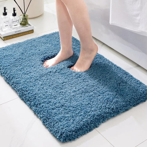 Ruggnovea blue plush-pile bathroom rug with non-slip backing for safety