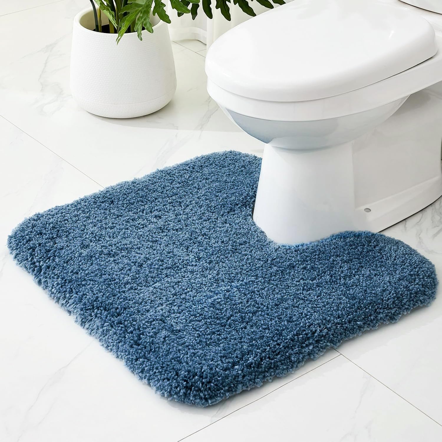 Ruggnovea blue U-shaped toilet rug with non-slip backing keeps floors dry.