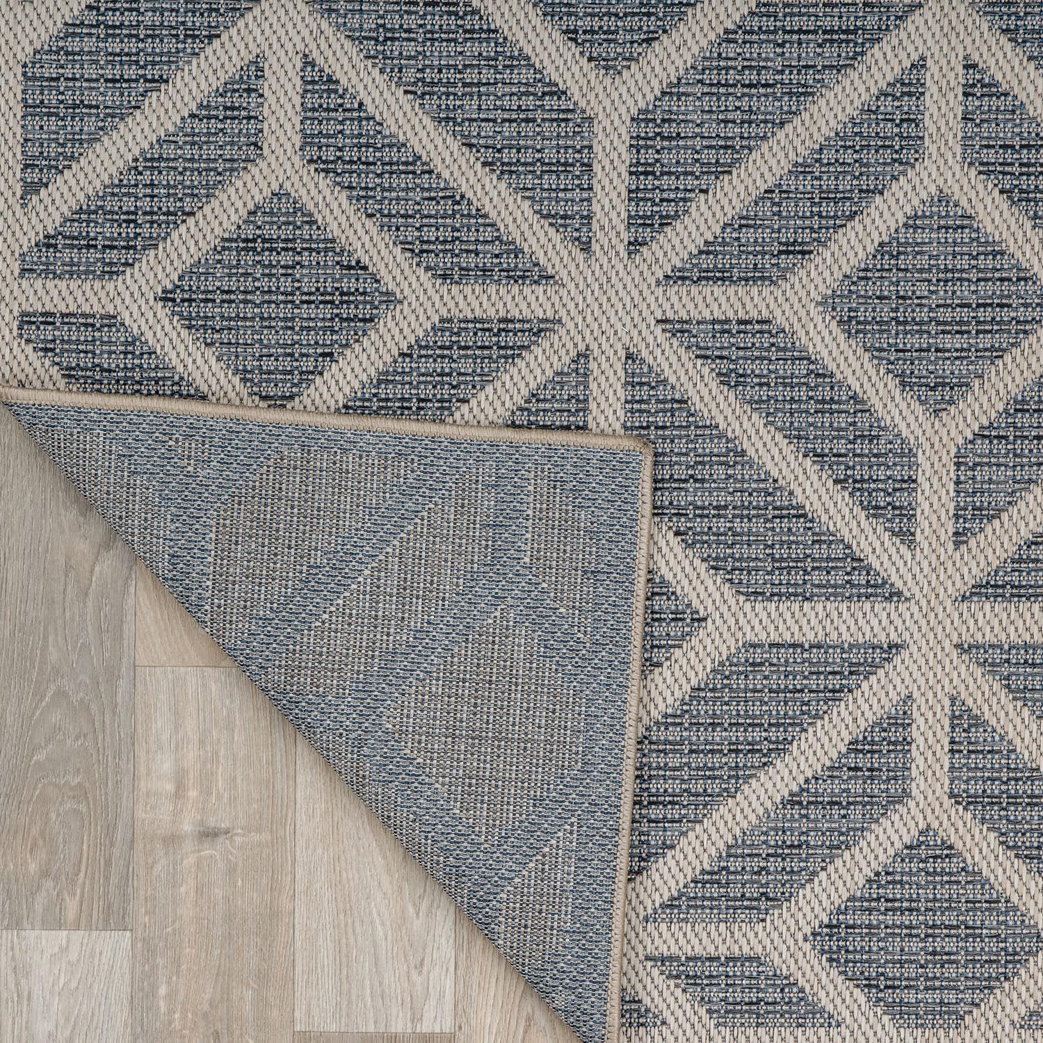 Rugshop Blue Durable polypropylene yarn conveys weather resistance for busy spaces.