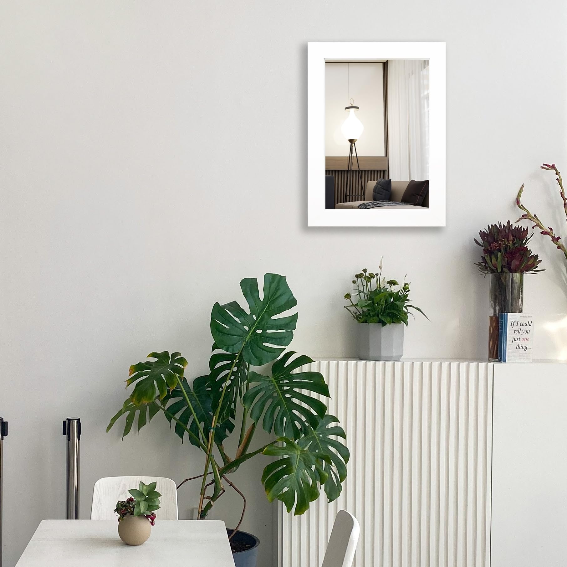 Ruomeng 12x16 white frame mirror adds subtle shine to living room decor