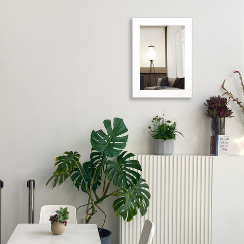 Ruomeng 12x16 white frame mirror adds subtle shine to living room decor