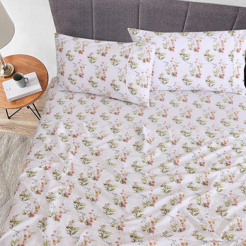 RUVANTI Floral Bliss Sheets draped on bed highlight lightweight, cool summer sleeping surface.