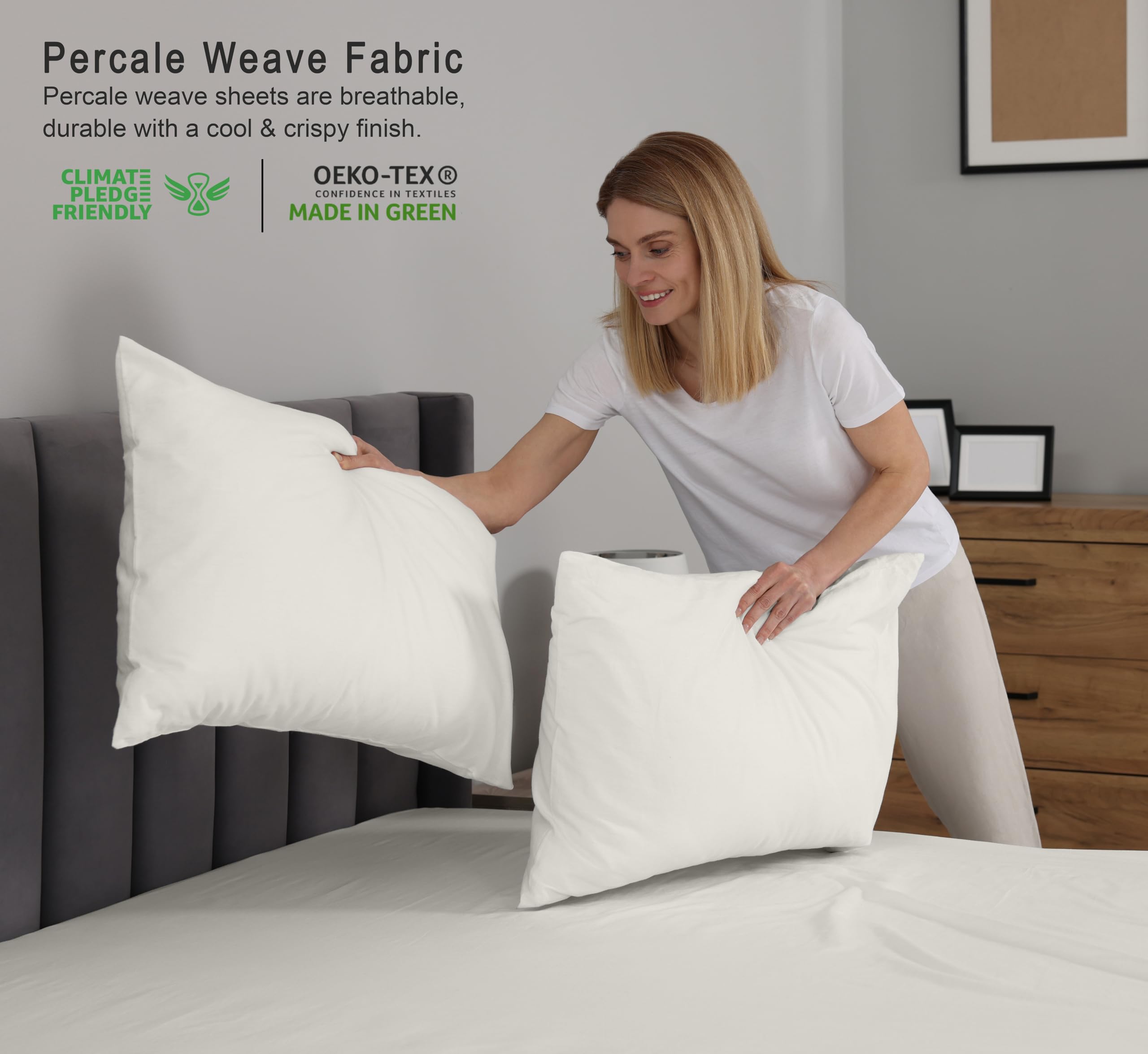 RUVANTI ivory pillowcase pair completes crisp, soft bedding.