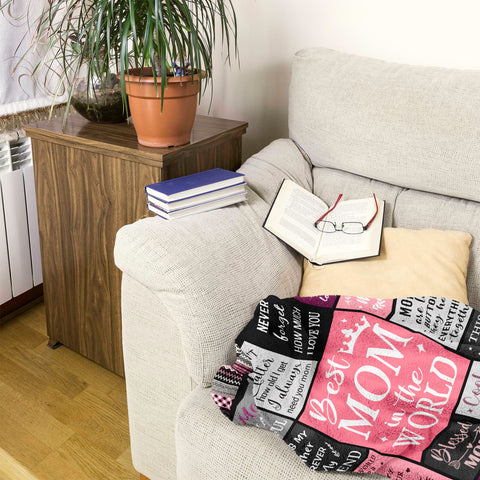 Ruvinzo blanket draped over sofa demonstrates versatile all-season warmth and decor.