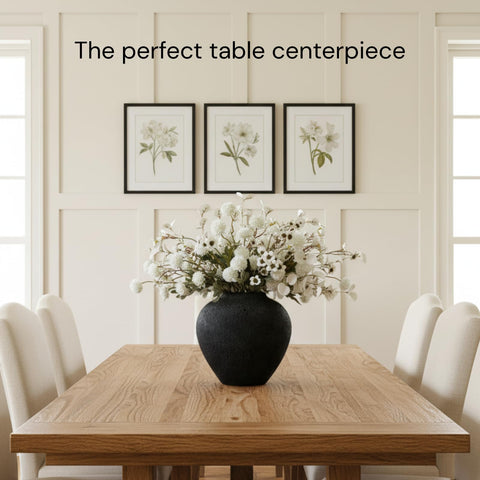 RyddeligHome Arina black vase with flowers—elegant focal point on dining tables.