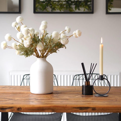 Durable iron construction of the Arlo vase underscoring stability for large stems