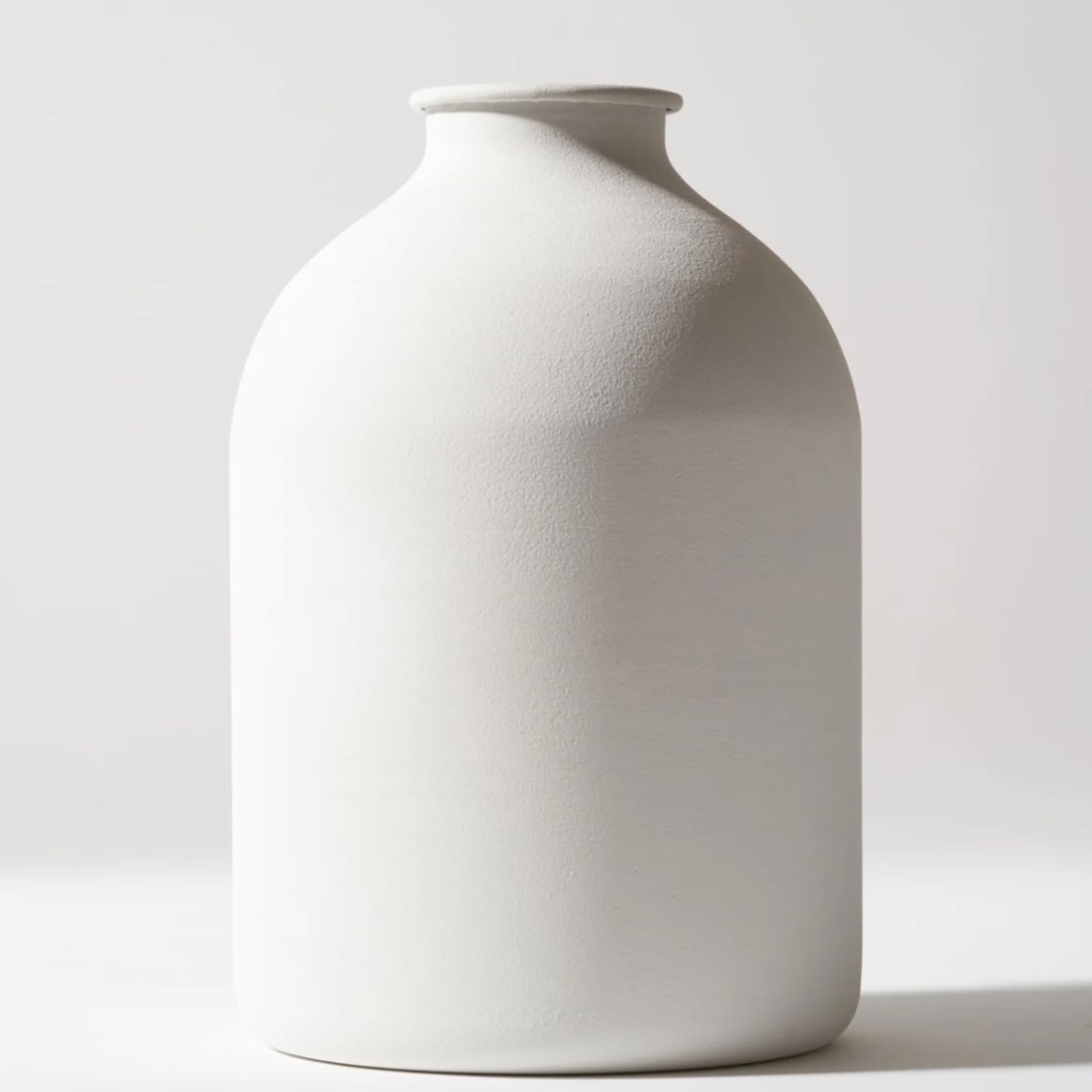 RyddeligHome Arlo large white vase on a dining table showing its minimalist silhouette and matte finish