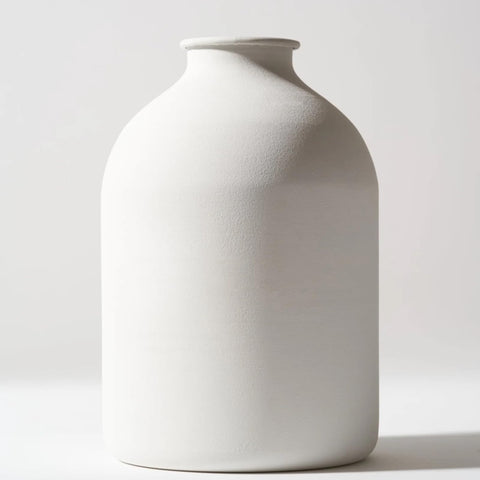RyddeligHome Arlo large white vase on a dining table showing its minimalist silhouette and matte finish
