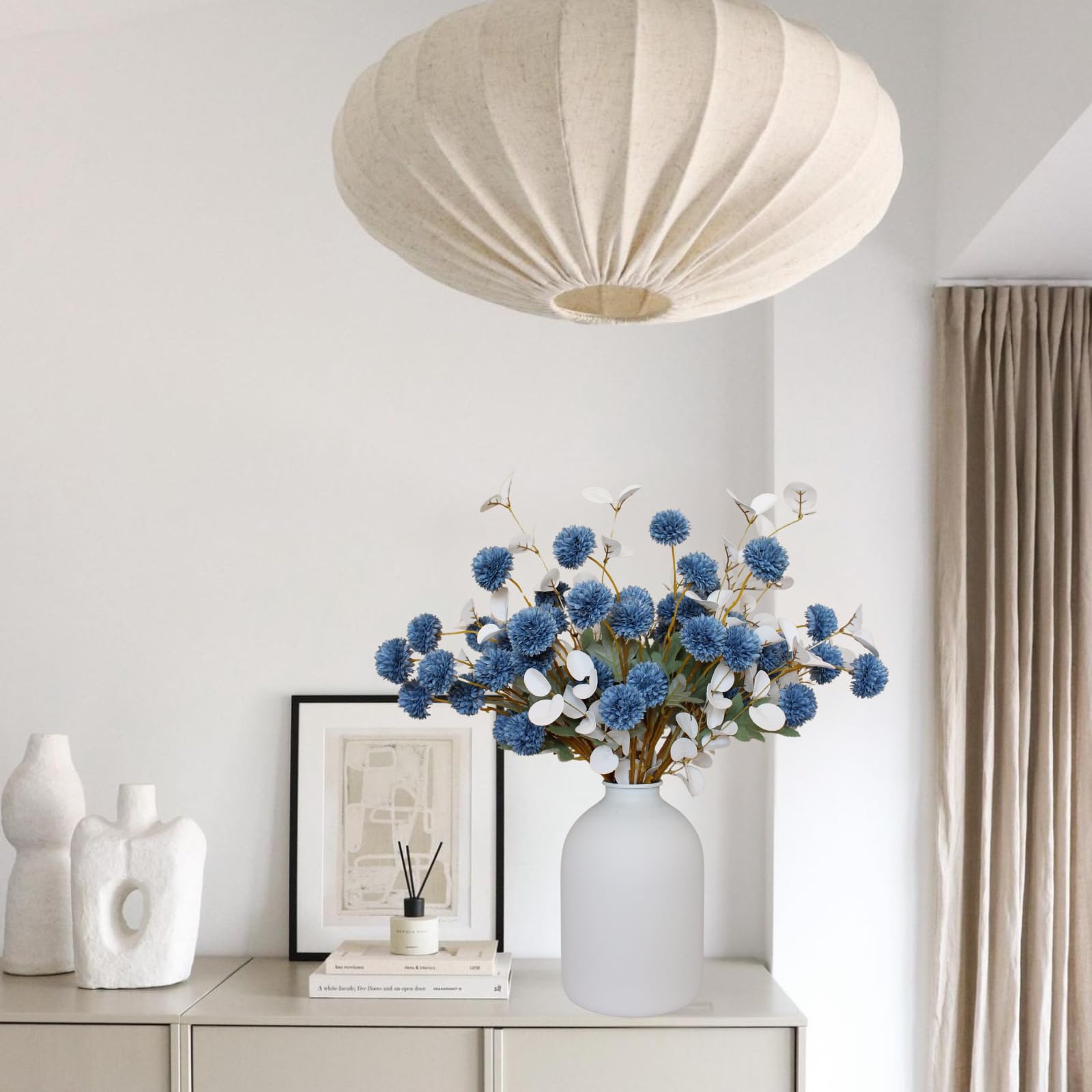 RyddeligHome silk mums and blue tones create versatile centerpieces for tables.