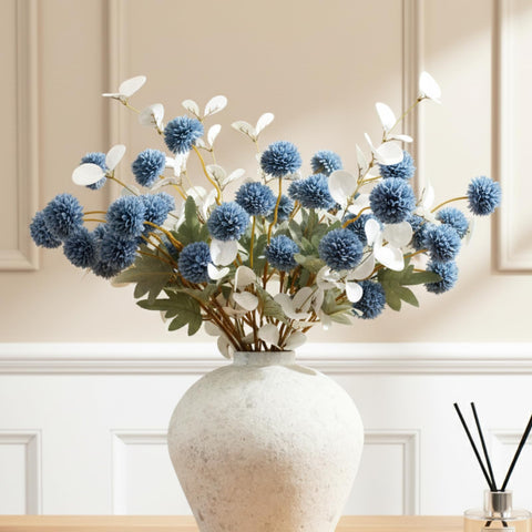 RyddeligHome dusty-blue flowers with white eucalyptus stems for elegant centerpieces.