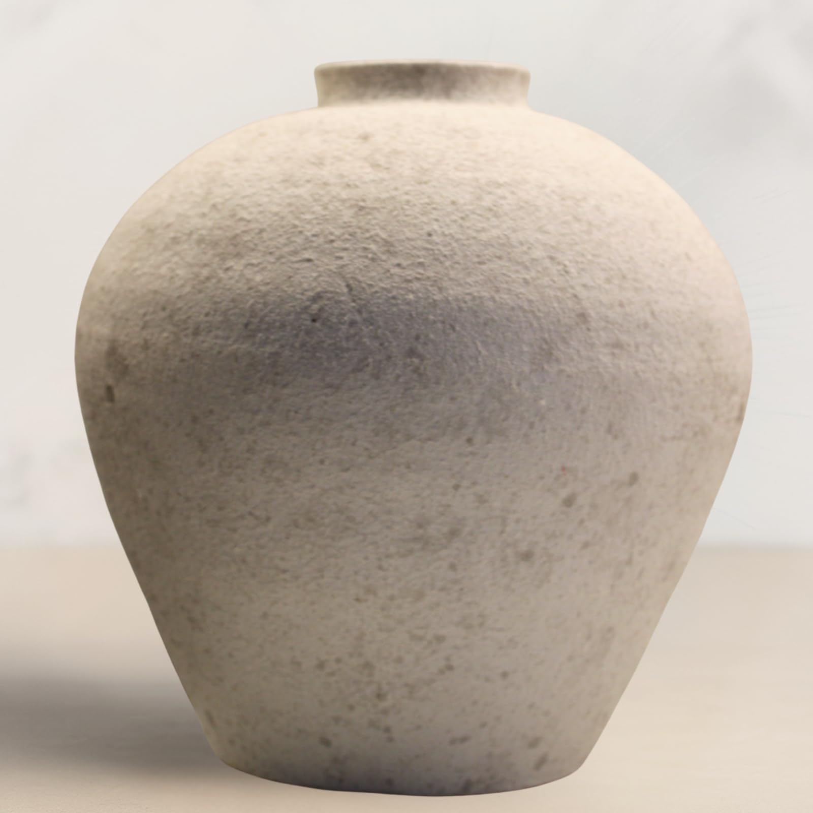 RyddeligHome handmade large round vase centerpiece elevates dining table decor.