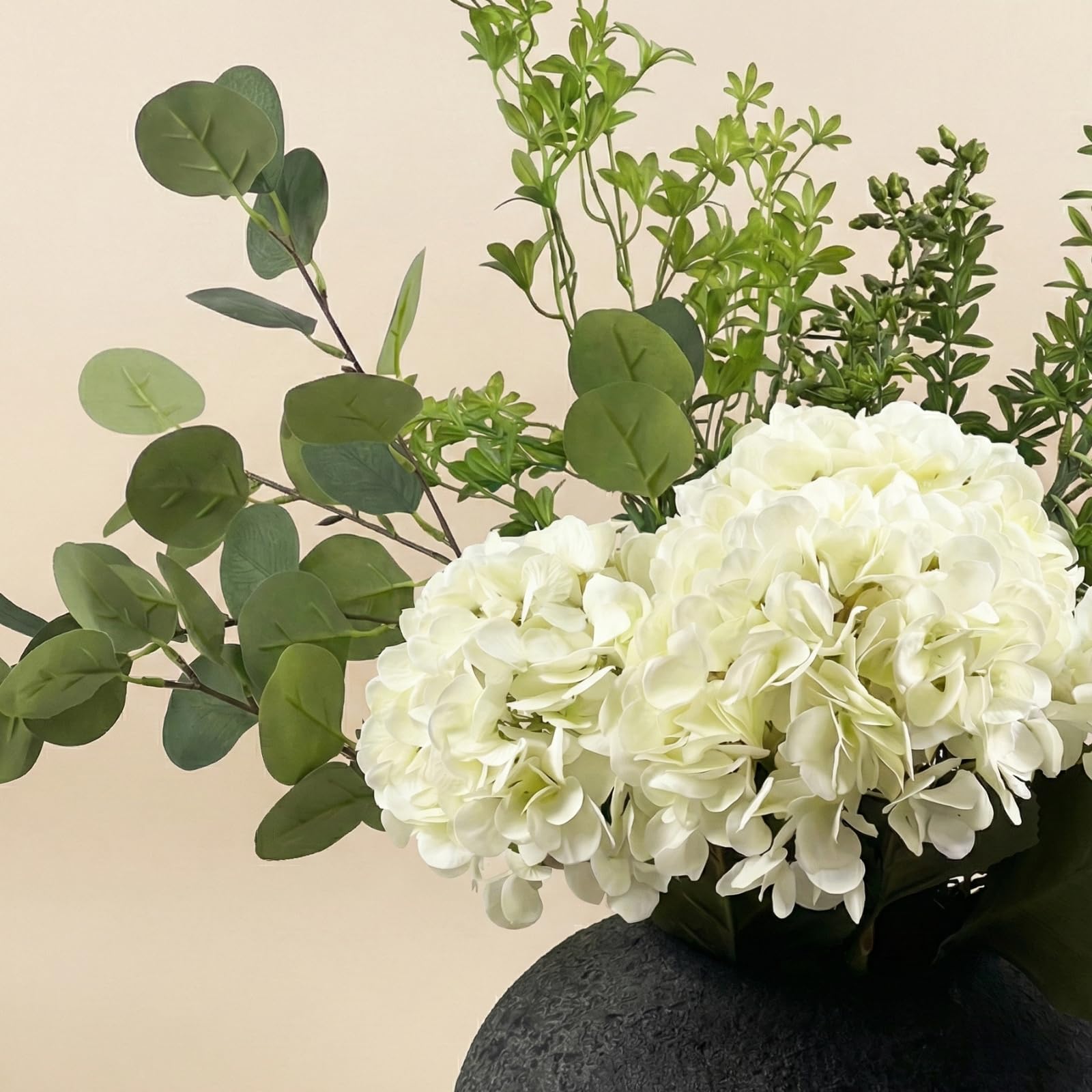 RyddeligHome versatile faux arrangement for entryways and living spaces.