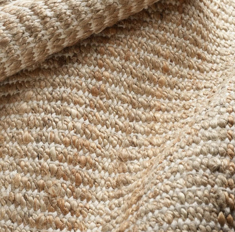 S & L Homes Jute Pulse Rug enhances bedroom decor with subtle sheen.