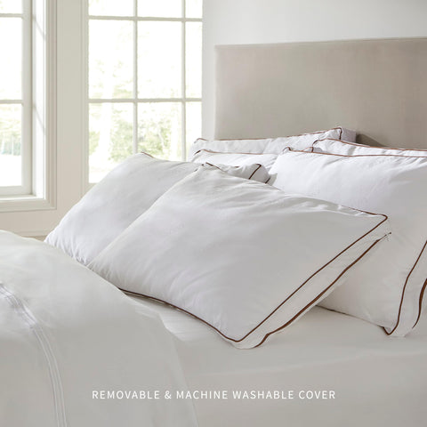 Saatva pillow on a bed demonstrates queen size ideal for multiple sleeping positions