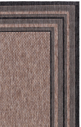 Safavieh Courtyard rug by poolside area evokes easy-clean maintenance.