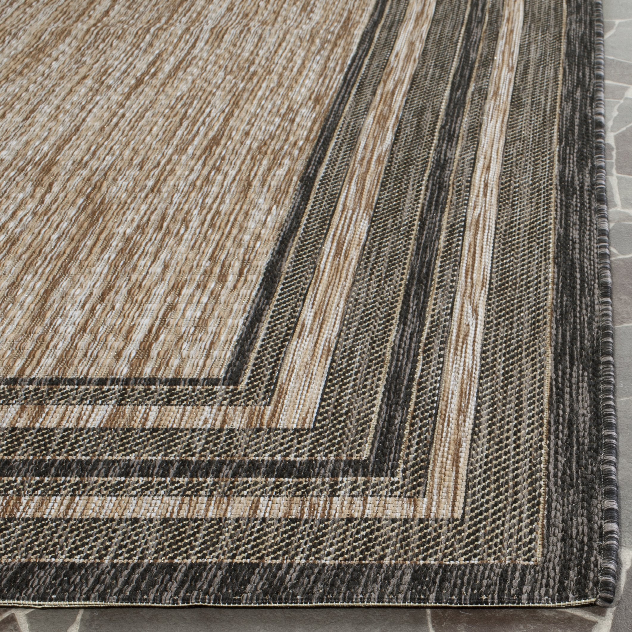 Safavieh Courtyard rug endures high-traffic entrances with comfort.