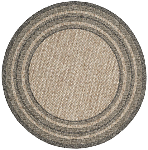 SAFAVIEH Courtyard round natural black rug ideal for mudrooms with kid- and pet-friendly design