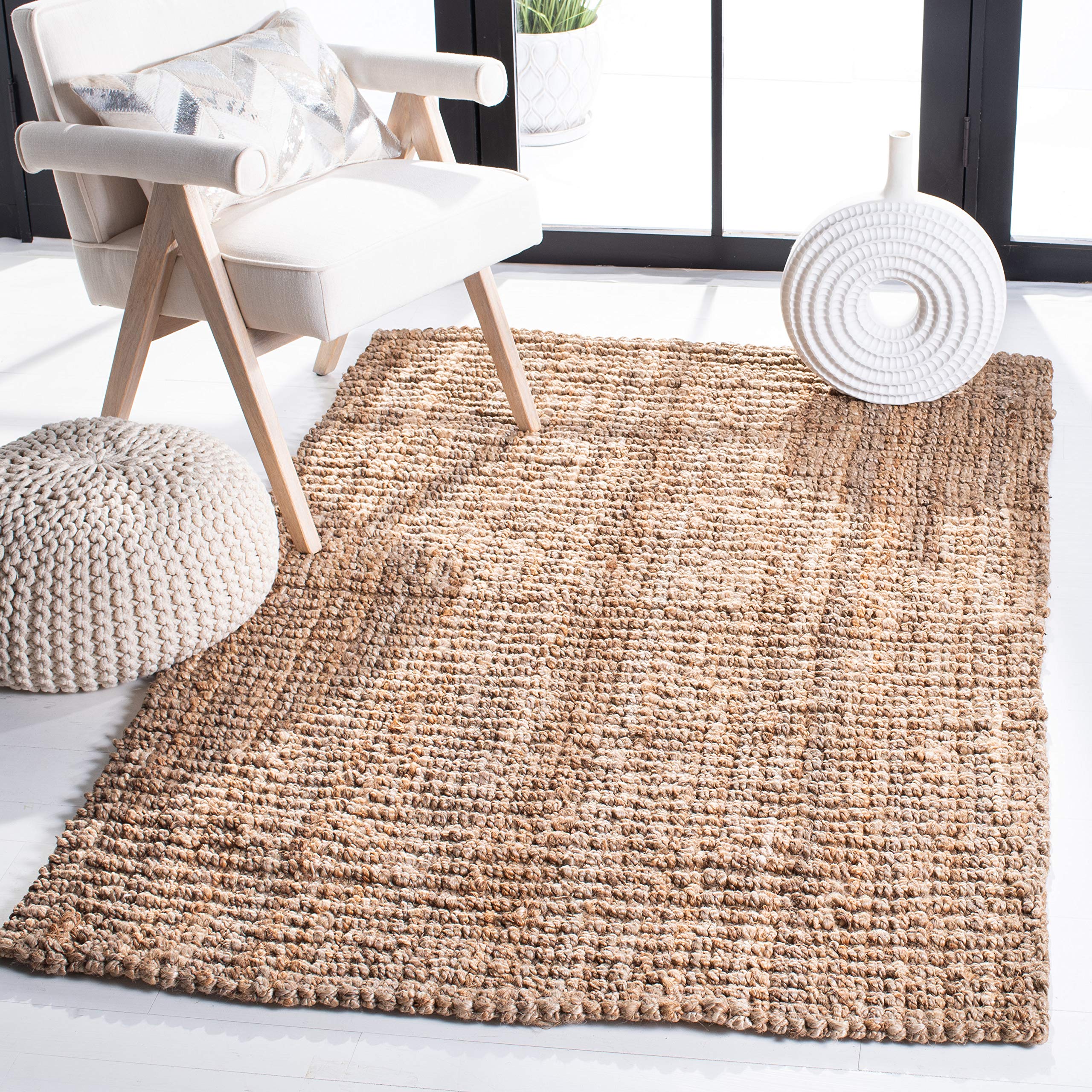 SAFAVIEH Natural Fiber rug with handmade natural-brown fibers adds warm, organic texture to any living space.