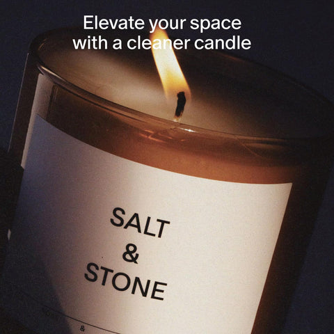 Salt & Stone candle lit close-up showing cotton wick and wax texture for mood setting.