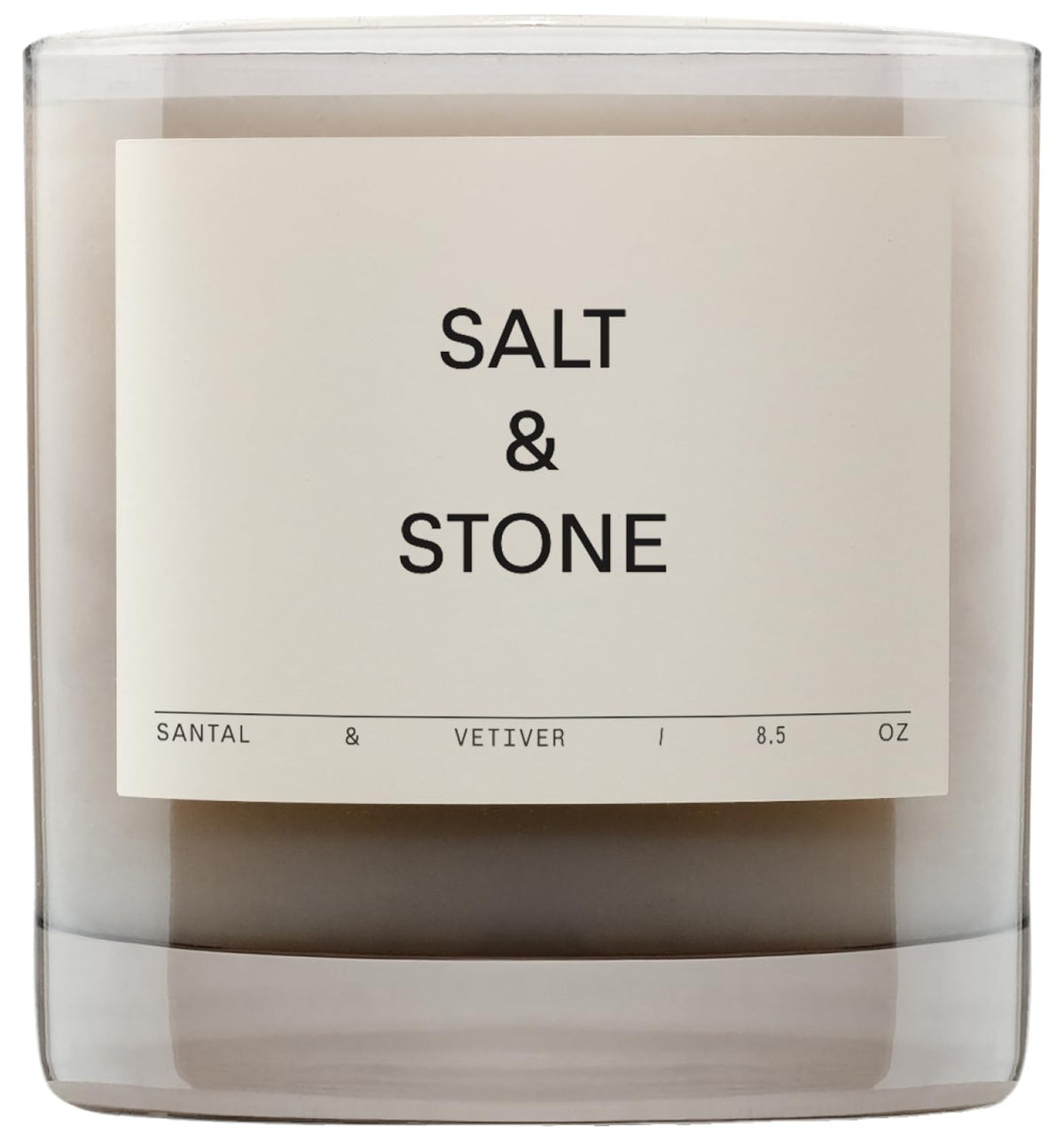 Salt & Stone Santal & Vetiver candle in glass jar, warm ambience.