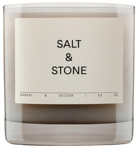 Salt & Stone Santal & Vetiver candle in glass jar, warm ambience.