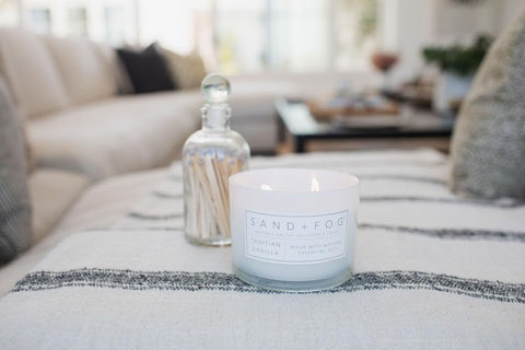 Sand + Fog candle in living room elevates décor and mood.