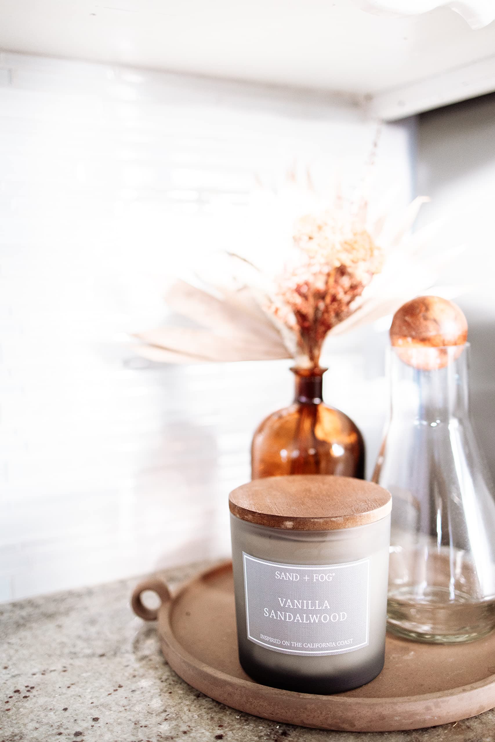 Sand + Fog candle in bathroom creates calming ambiance.