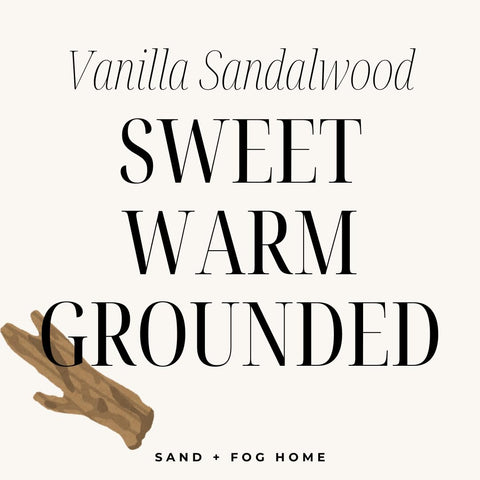 Sand + Fog candle in a cozy living room setting for inviting ambiance.