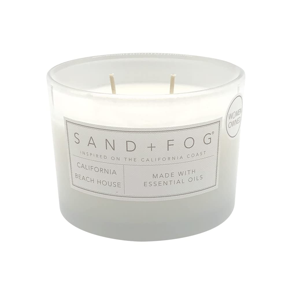 Sand + Fog candle lid with artwork enhances décor and shelf styling.