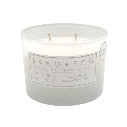 Sand + Fog candle lid with artwork enhances décor and shelf styling.
