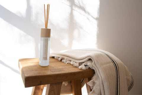 Ocean Mist diffuser with wood reeds arranged for a cozy mood